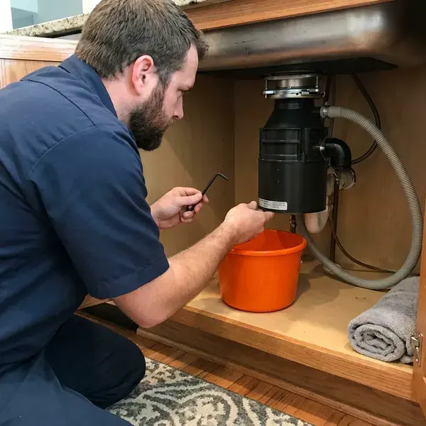HKL Plumbing technician providing garbage disposal repair in Urban Honolulu, HI